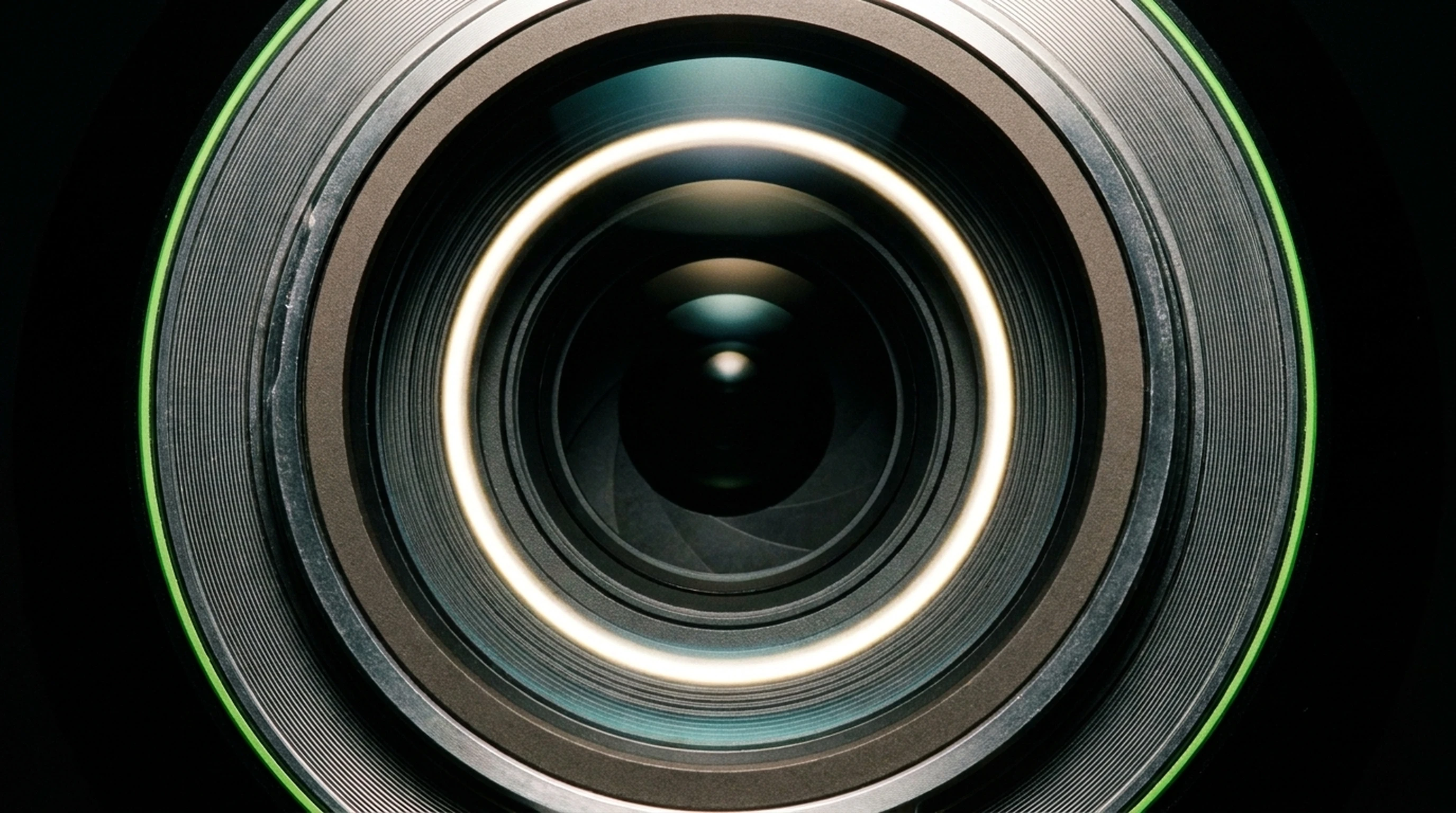 CGEYE Professional Photography — extreme macro of Sony A7R IV lens rear optical element, concentric light caustics, craft editorial precision